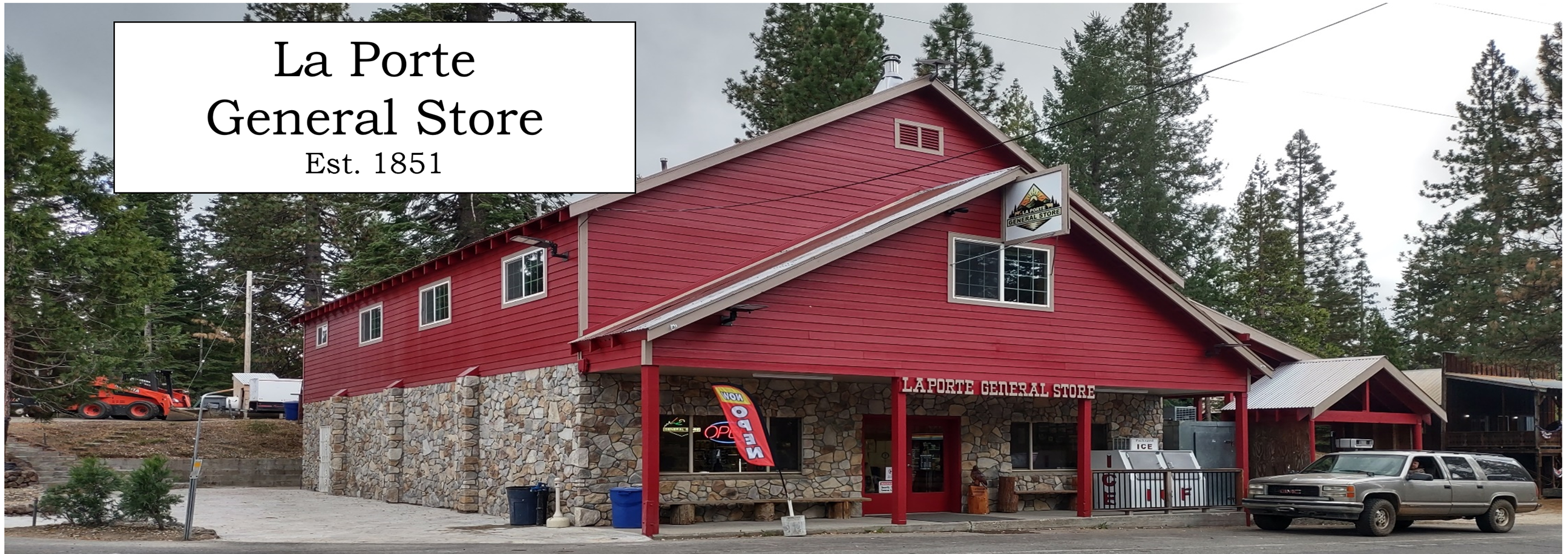 A building with a red roof
Description automatically generated