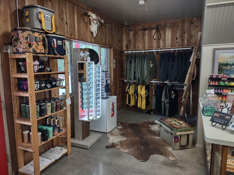 A room with a variety of clothes and items

Description automatically generated