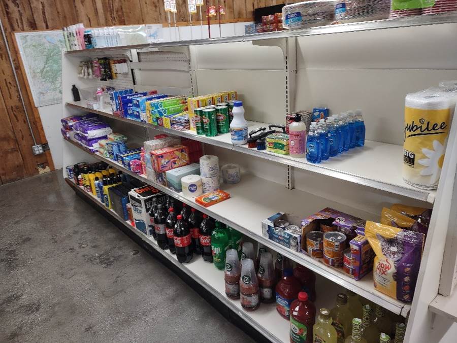 Shelves of a store with shelves of beverages
Description automatically generated
